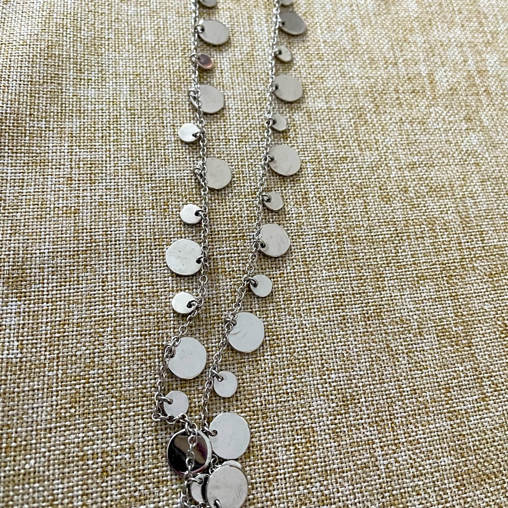 Statement piece! 
Lia Sophia long silver necklace
